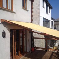 yellow awning fitted to a home