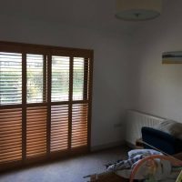 window shutters in wood colour