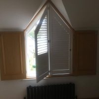 shutters installed onto arched window